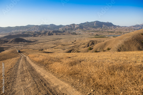 mountain landscape with an SUV