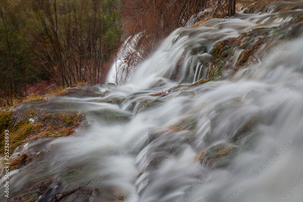Wonderful waterfall near tree Wonderful waterfall near tree