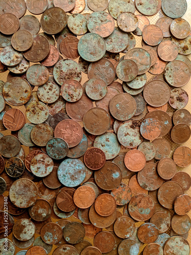 A pile of tarnished and partially corroded British copper coins - one and two pence pieces - and a lot of verdigris