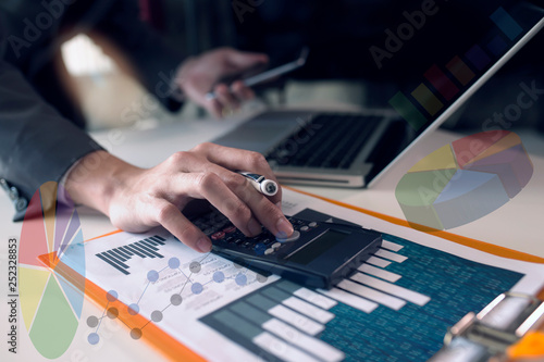 businessman analyzing financial data on digital tablet