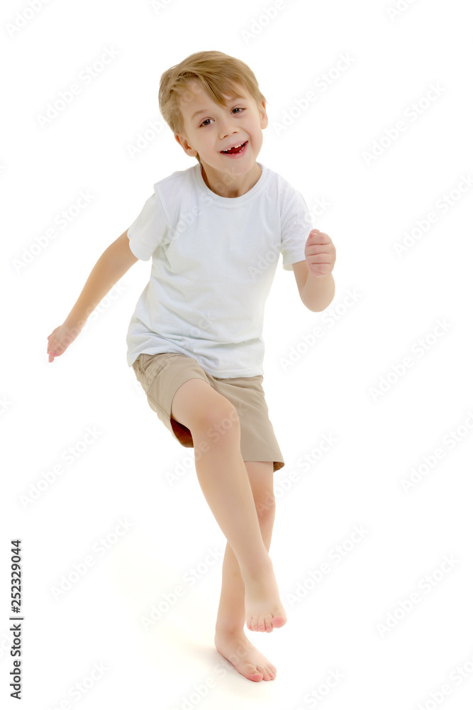 Emotional little boy in a pure white t-shirt. Emotional little boy in a pure white t-shirt.