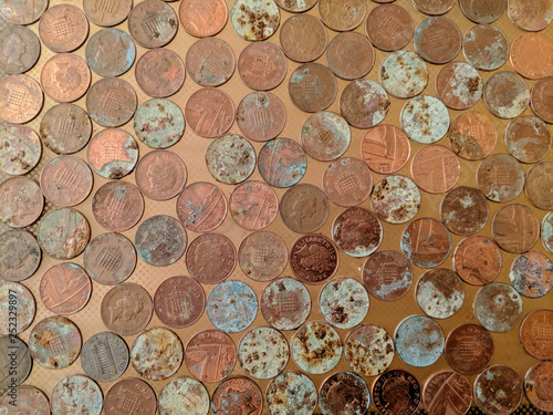 A pile of tarnished and partially corroded British copper coins - one pence pieces (1p) - and a lot of corrosion and verdigris