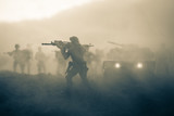 Military patrol car on sunset background. Army war concept. Silhouette of armored vehicle with gun in action. Decorated. Selective focus