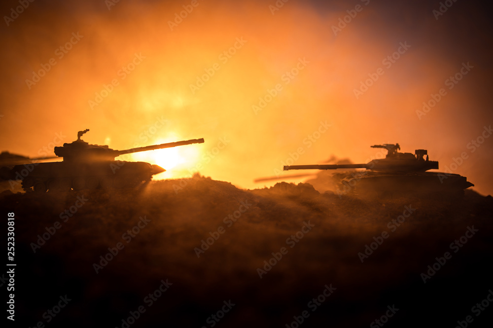 Fototapeta premium War Concept. Military silhouettes fighting scene on war fog sky background, World War Soldiers Silhouettes Below Cloudy Skyline at sunset. Attack scene. Armored vehicles.