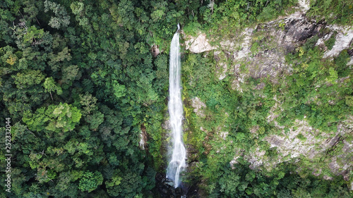 Bejuco Falls Waterfall in Pico Bonito National Park in Honduras. Aerial drone photo from above. Tall, big, dramatic and powerful waterfall in the jungle.  photo