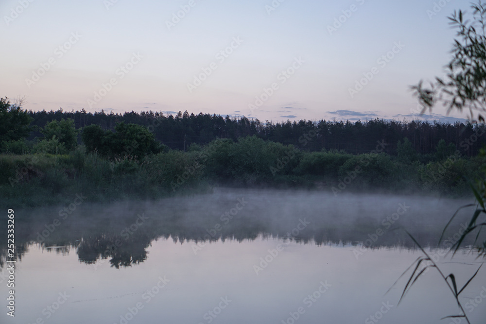 Pretty river in the countryside is shrouded in mist. European landscape of Russia and Siberia. calm view of nature. Stock background, photo Pretty river in the countryside is shrouded in mist. European landscape of Russia and Siberia. calm view of nature. Stock background, photo