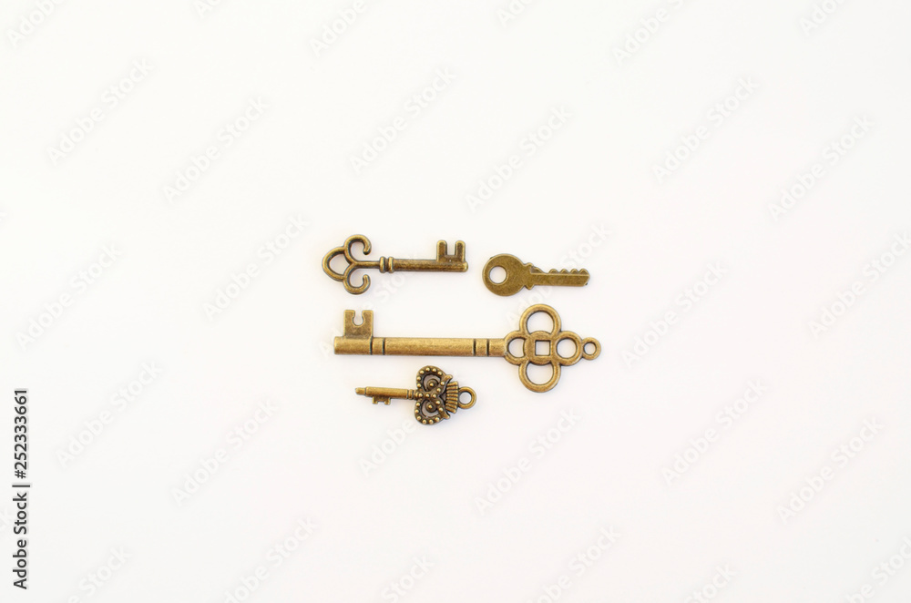 Decorative keys of different sizes, stylized antique on a white background. Form the centerpiece. four keys Decorative keys of different sizes, stylized antique on a white background. Form the centerpiece. four keys