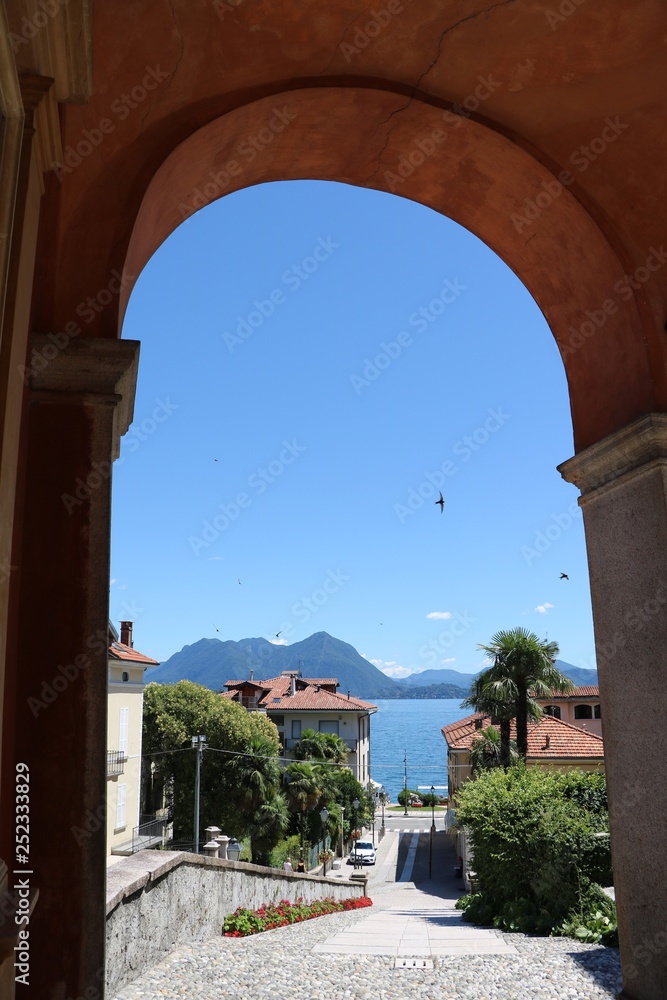 Portico of Church of Saints Gervaso and Protaso in Baveno with view to  Lake Maggiore, Italy