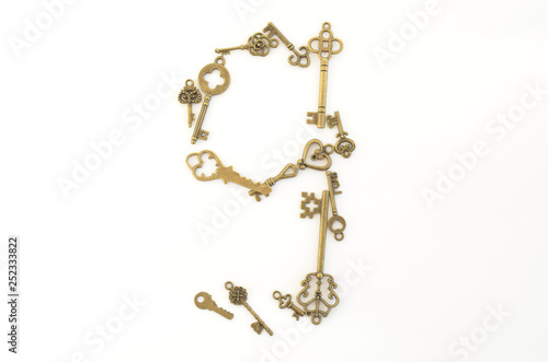 Decorative keys of different sizes, stylized antique on a white background. Number nine