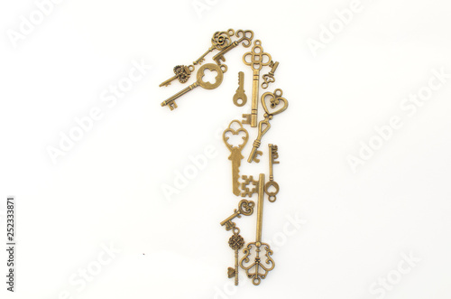 Decorative keys of different sizes, stylized antique on a white background. Form the centerpiece. Number one