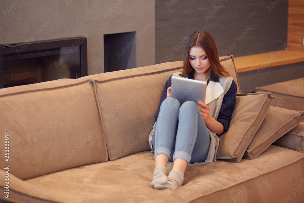 beautiful girl resting on a chic couch beautiful girl resting on a chic couch