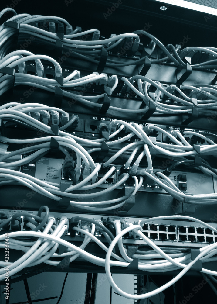 close up of network server panel, switch and cable in data center close up of network server panel, switch and cable in data center