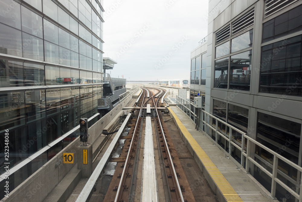 train tracks at station between buildings train tracks at station between buildings