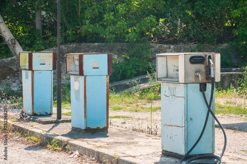 Old abandoned vintage obsolete petrol fuel gas dispenser in former