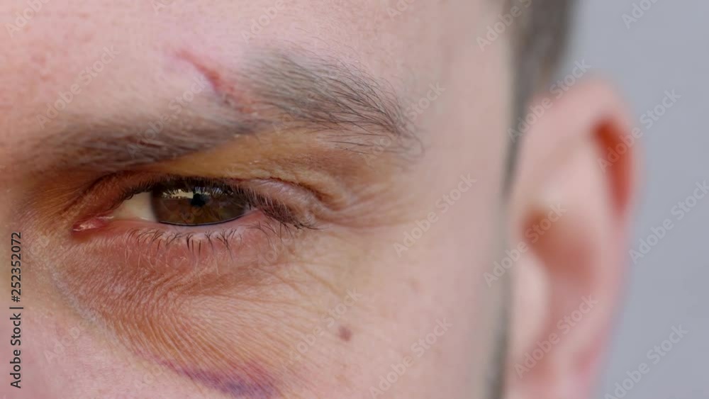 Close-up of handsome male eye is looking at the camera - the eyebrow is ...