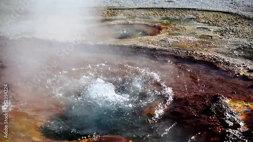 Bubbling water in geyser pool in Yellowstone National Park, Wyoming, USA.