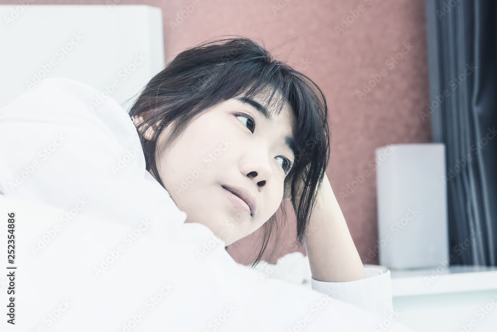 Asian woman wake up on bed in bedroom in the morning.at home in holiday. Asian woman wake up on bed in bedroom in the morning.at home in holiday.