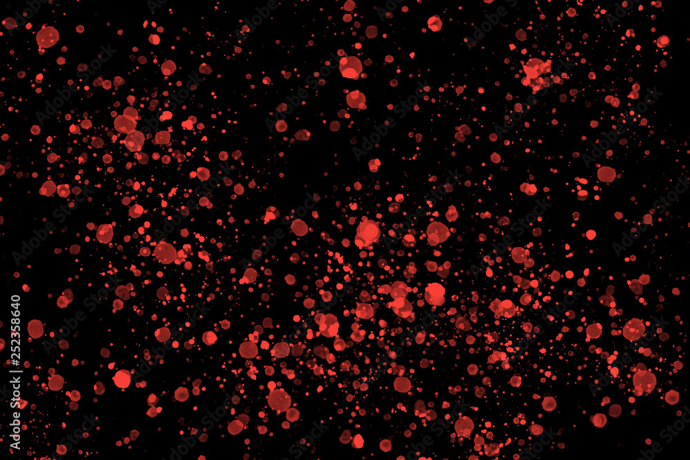 Bright marsala red color random round watercolor paint splashes on black background with abstract dark texture