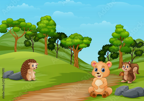 Happy bear and hedgehog enjoying on the hill