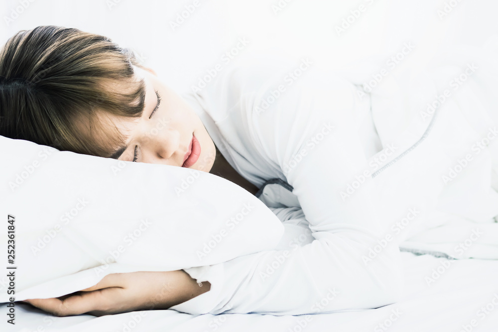 Asian woman sleep on white pillow on bed in bedroom in holiday.happy relax time. Asian woman sleep on white pillow on bed in bedroom in holiday.happy relax time.