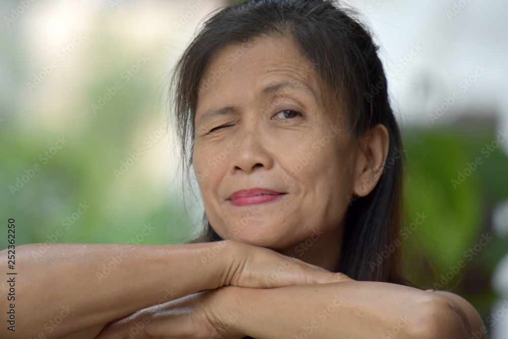 Older Asian Female Senior Winking Older Asian Female Senior Winking