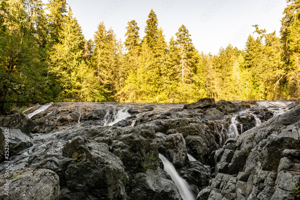 canadian landscape with small waterfall in the rain forest. canadian landscape with small waterfall in the rain forest.