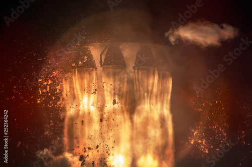 Canvas Print Rocket engines and fire duting the missile launch at night, close up