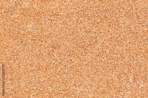 Brown cork board surface for background.