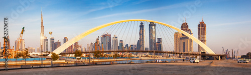 Canvas Print colorful sunset over Dubai Downtown skyscrapers and the newly built Tolerance br