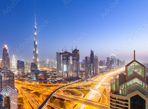 DUBAI, UAE - FEBRUARY 16: Burj Khalifa the tallest building in the world. Dubai Downtown cityscape. Dubai evening skyline, busy Sheikh Zayed road intersection, sunset on February 16, 2018 in Dubai