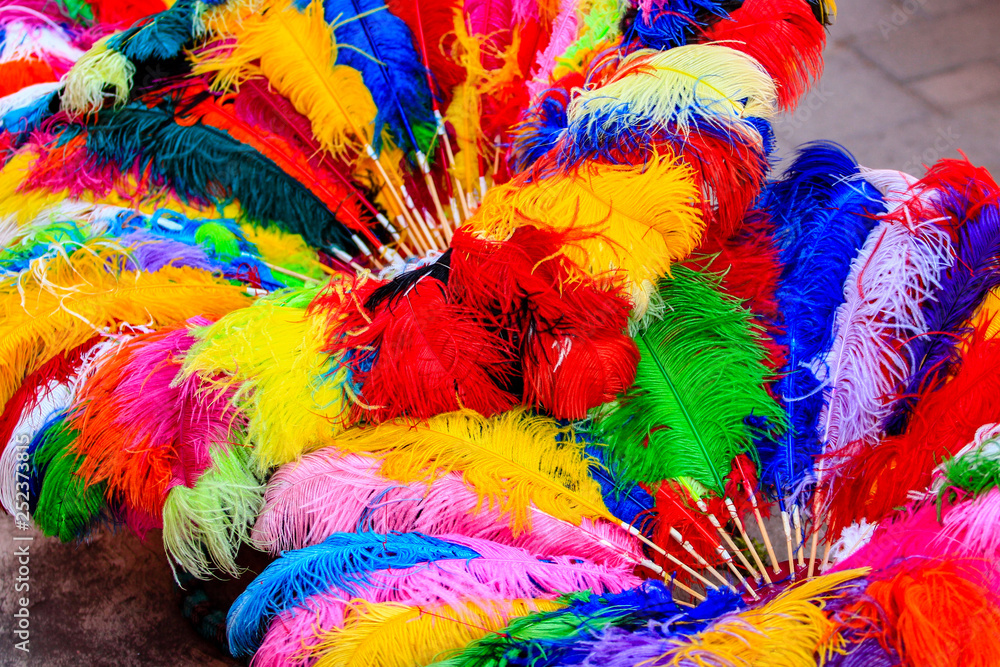 top view of a colorful mexican ornament made with ostrich feathers in bright colors during mexican carnival in Tlaxcala