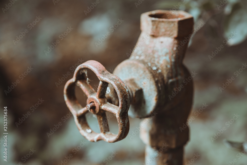 Old worn out water pipes. Broken hydraulic valve, crane. Old pipes of heating. Torn conduits. Large heat loss. Obsolete not efficient technologies in construction