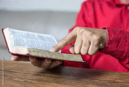 Man reading the Holy Bible. book