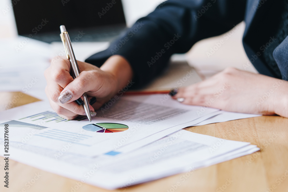 Businesswoman working with new startup project data financial report. Loan investment documents. Financial and Installment payment concept. Businesswoman working with new startup project data financial report. Loan investment documents. Financial and Installment payment concept.