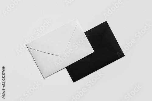 Blank black and white paper envelope on a soft gray background.For your design.mockup. 