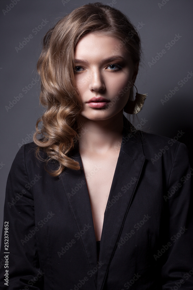 Portrait of a beautiful woman in a black jacket. Portrait of a beautiful woman in a black jacket.