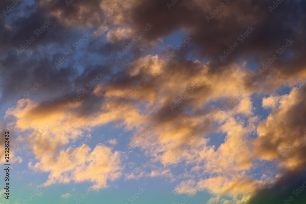 amazing toned sun colored clouds in the sky for using in design as background.