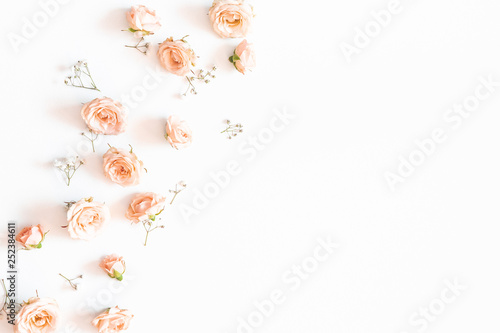 Flowers composition. Rose and gypsophila flowers on white background. Flat lay, top view, copy space