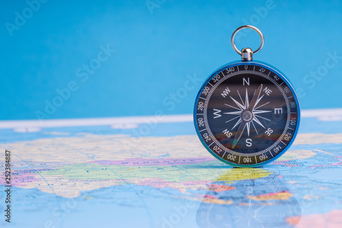 Kuala Lumpur, MALAYSIA FEBRUARY 27, 2019: Compass on world map background. Selective focus