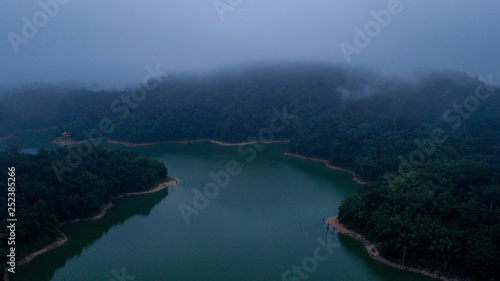 A beautiful landscape of aerial view with the fog surrounding the hill area in Royal Belum Malaysia