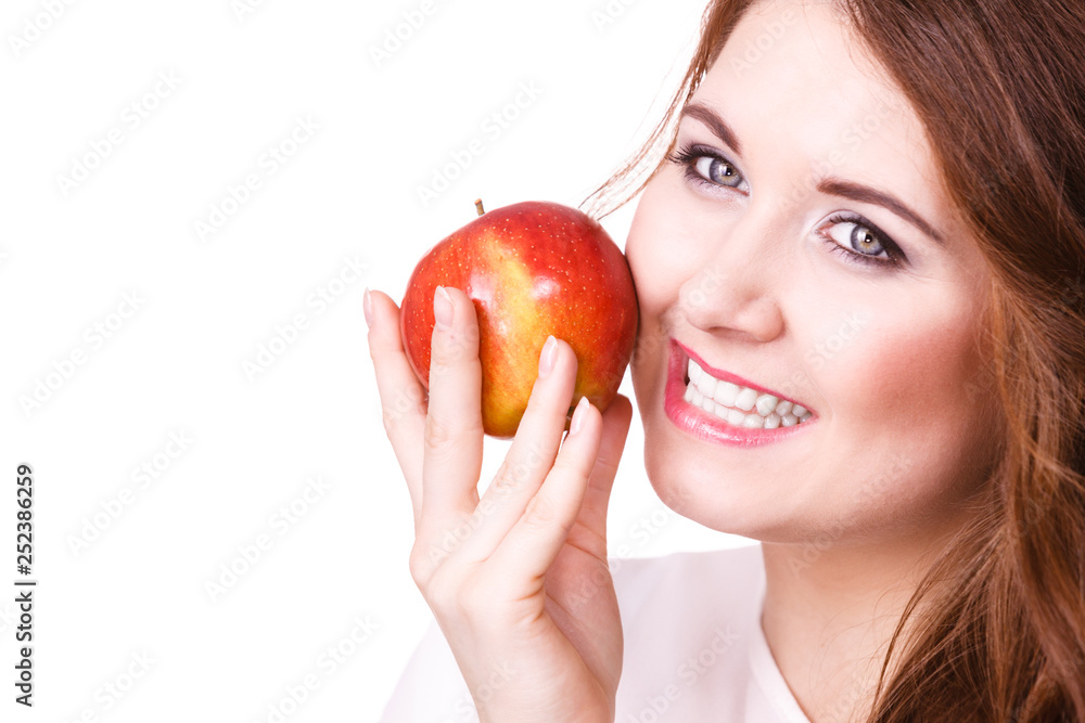 Woman holds apple fruit close to face, isolated Woman holds apple fruit close to face, isolated