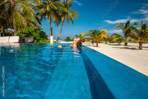 Woman at beach pool in Maldives