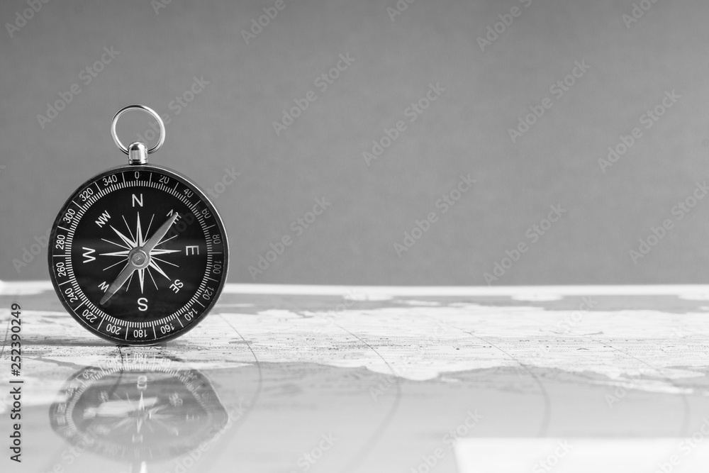 Kuala Lumpur, MALAYSIA FEBRUARY 27, 2019: Compass on world map background. Selective focus,Business and Travel Concept. Black and White