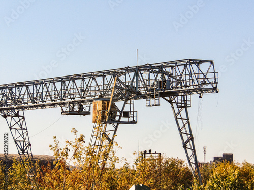 Outdoors gantry crane on a blue sky background photo