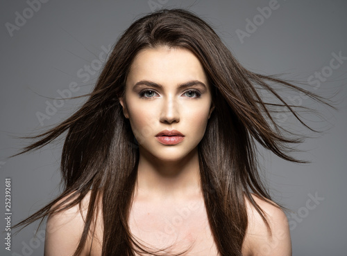 Brunette woman with  long brown hair.