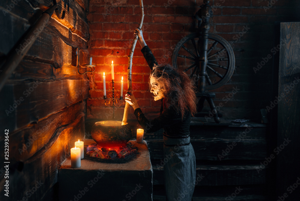 Scary witch cooking soup and reads spell