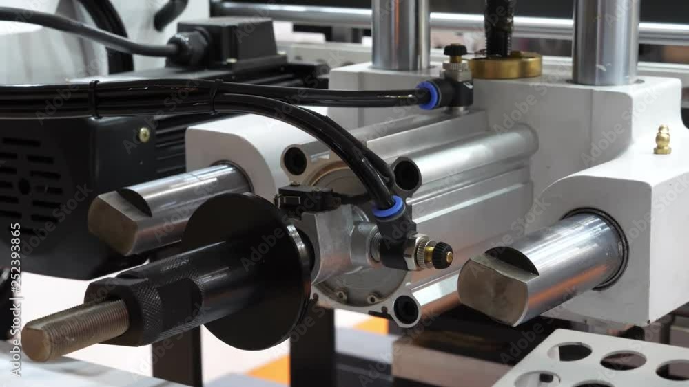 Operating automatic industrial machine. Automated line in factory. Close-up. Operating automatic industrial machine. Automated line in factory. Close-up.