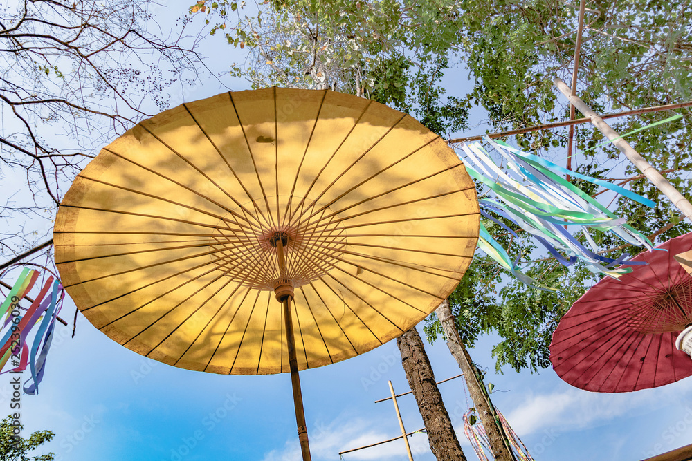 Fototapeta premium Yellow umbrella and blue sky.