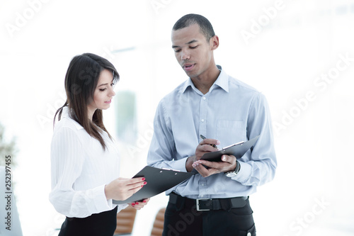 businessman and the employee discussing work schedule.