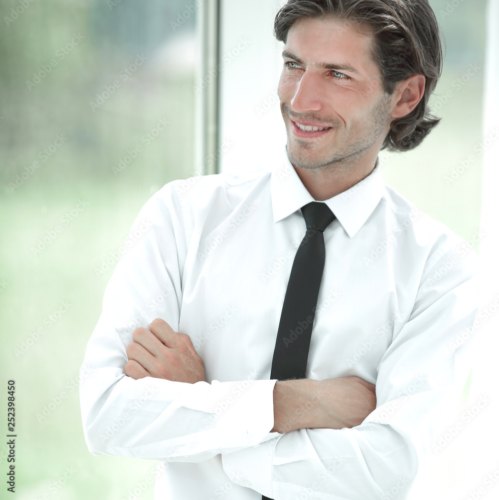 portrait of successful businessman on background of office portrait of successful businessman on background of office